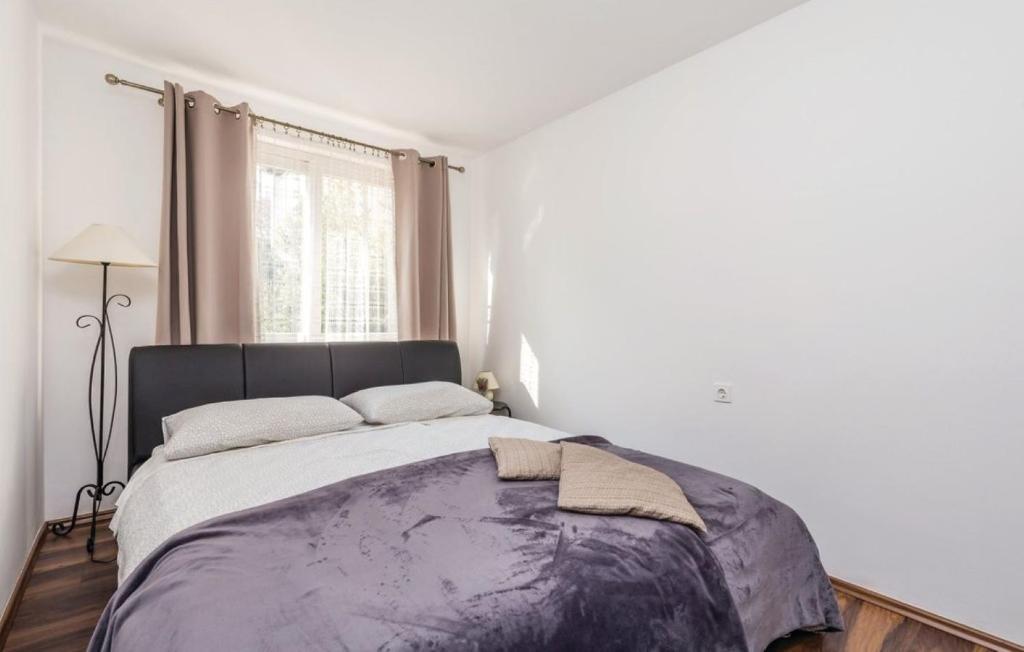 Postel nebo postele na pokoji v ubytování Casa Fiorella Ika-Opatija