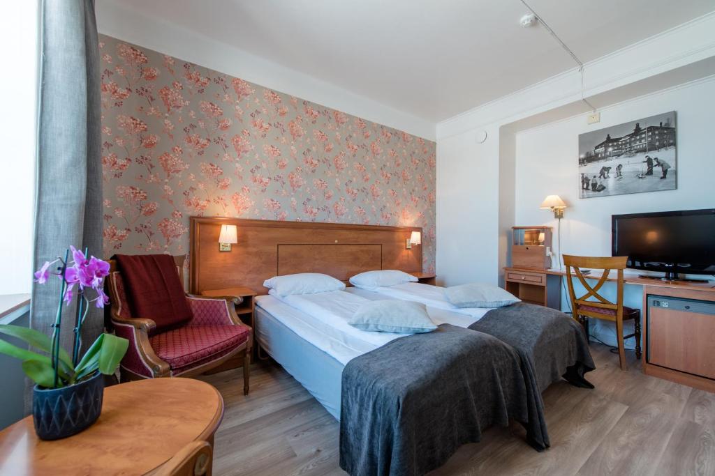 Postel nebo postele na pokoji v ubytování Oppdal Turisthotell