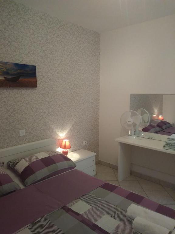 Postel nebo postele na pokoji v ubytování Apartments Soljacic