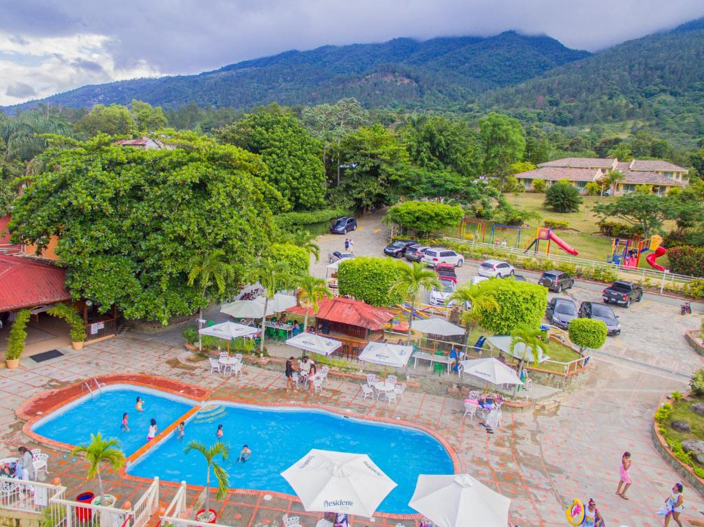 an overhead view of a pool at a resort at Jarabacoa River Club & Resort in Jarabacoa