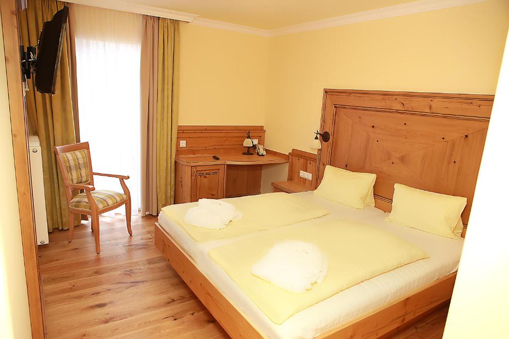 Postel nebo postele na pokoji v ubytování Hotel Kornock