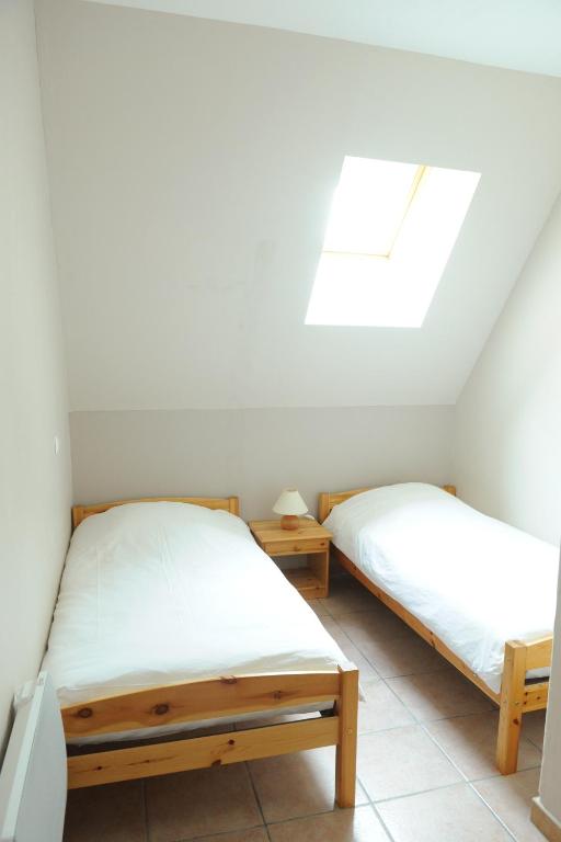 Postel nebo postele na pokoji v ubytování Domaine de l'Asenon