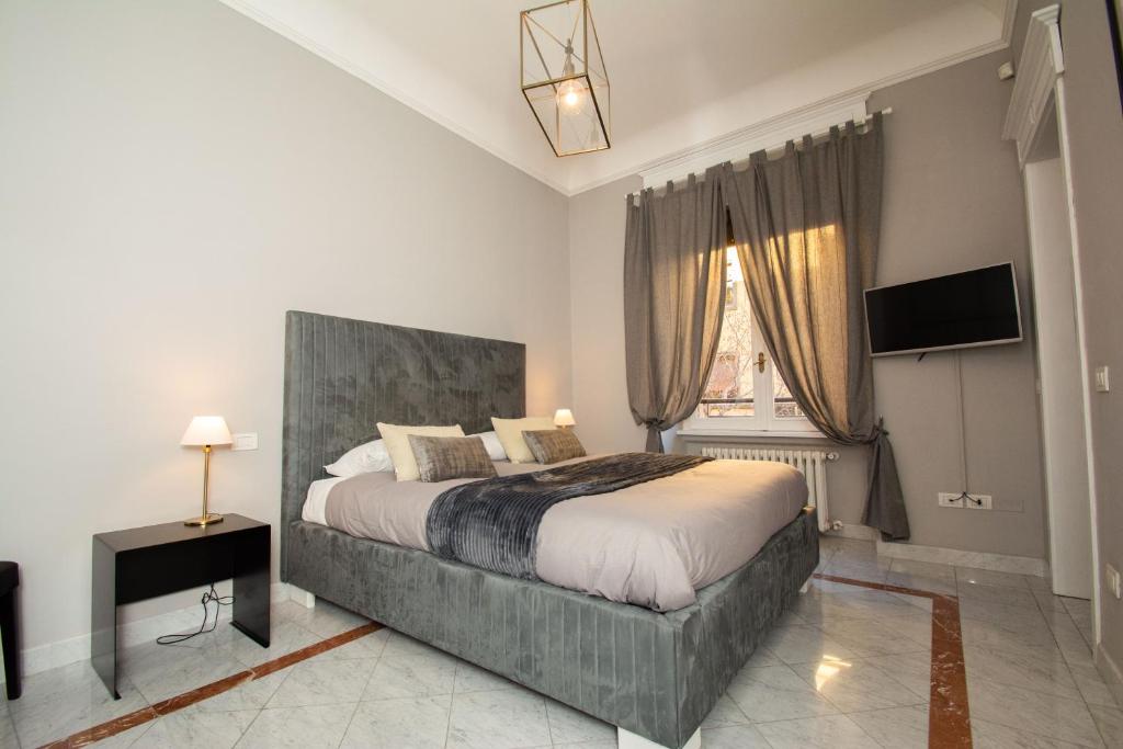 Postel nebo postele na pokoji v ubytování Compasso Suites