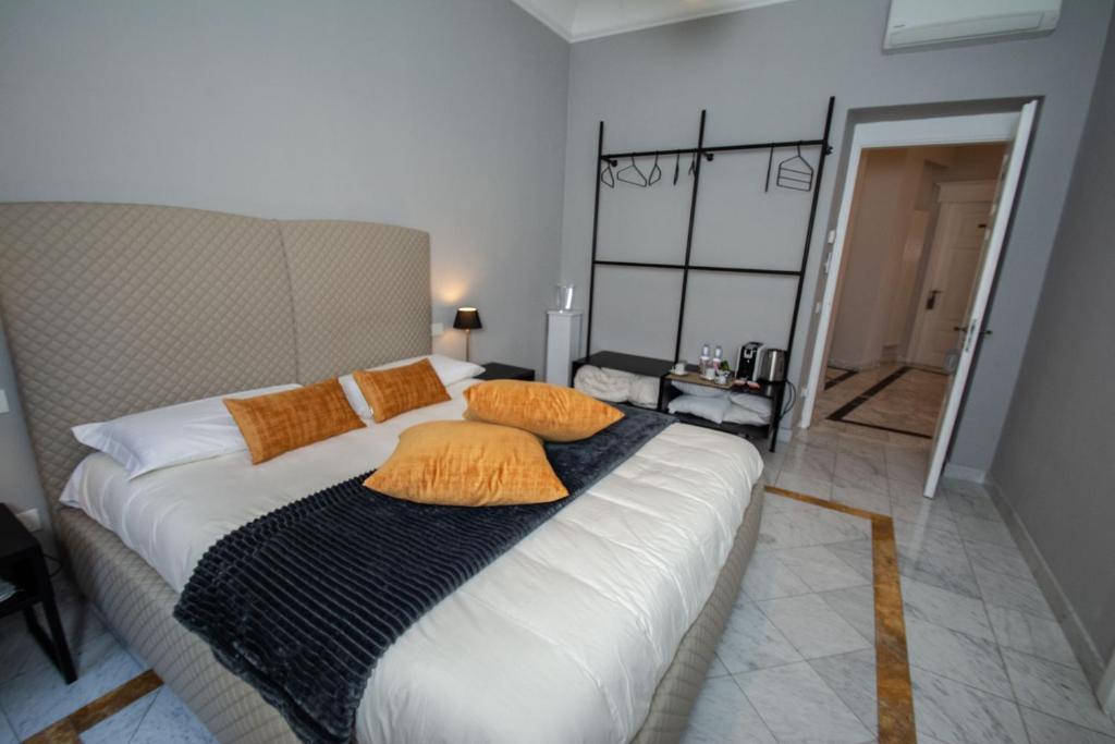 Postel nebo postele na pokoji v ubytování Compasso Suites