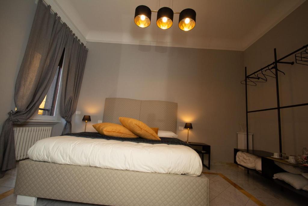 Postel nebo postele na pokoji v ubytování Compasso Suites