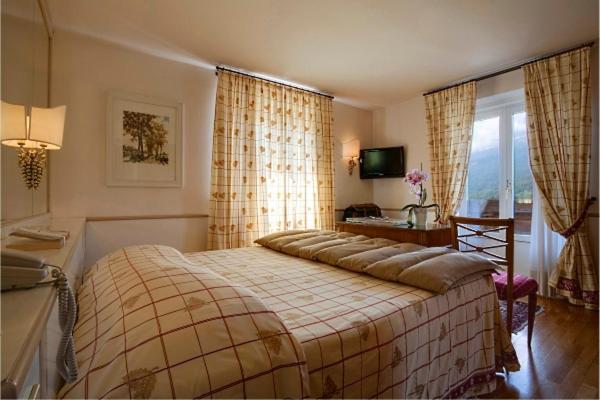 Кровать или кровати в номере Hotel De La Poste