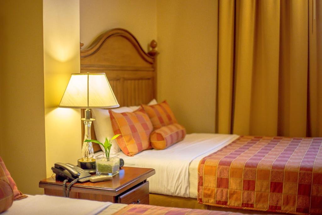 Cama o camas de una habitación en Hotel Monteolivos