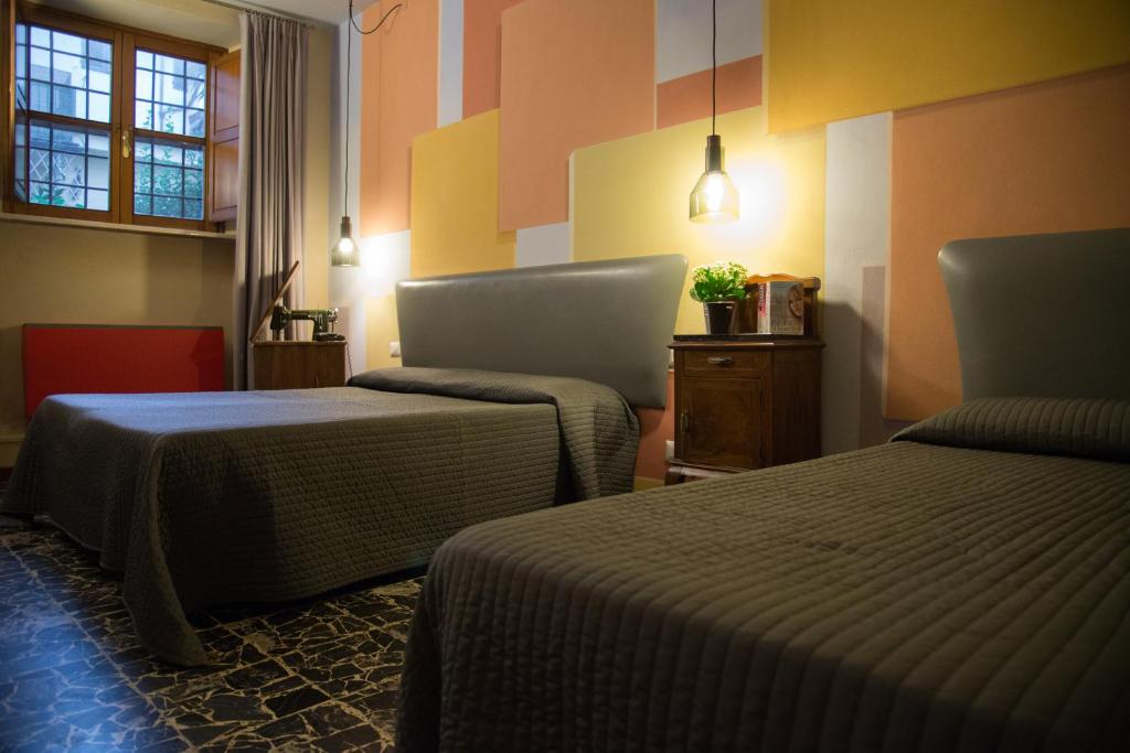 Postel nebo postele na pokoji v ubytování Hotel Diana & Depandance