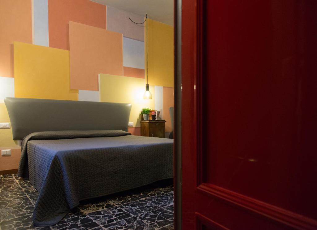 Postel nebo postele na pokoji v ubytování Hotel Diana & Depandance