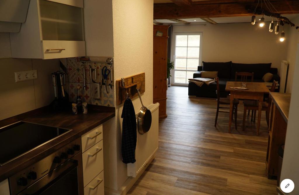 a kitchen and living room with a kitchen and a dining room at Tarahaus in Sankt Georgen im Schwarzwald