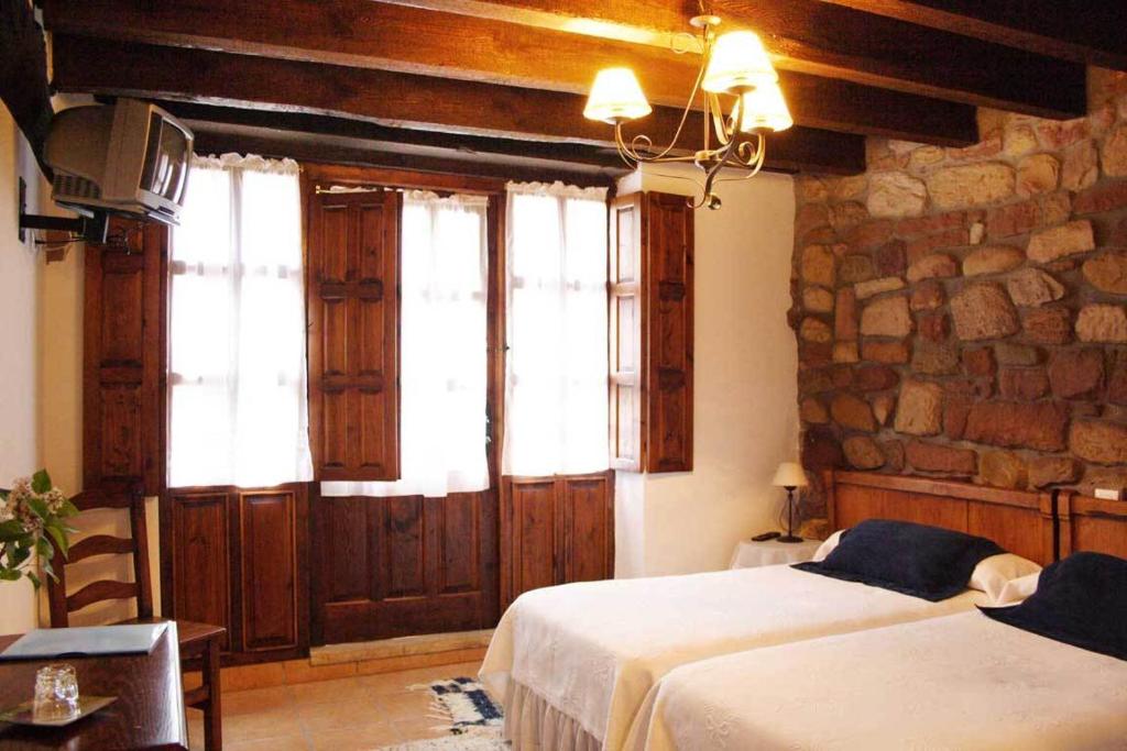 Postel nebo postele na pokoji v ubytování Casa Velarde