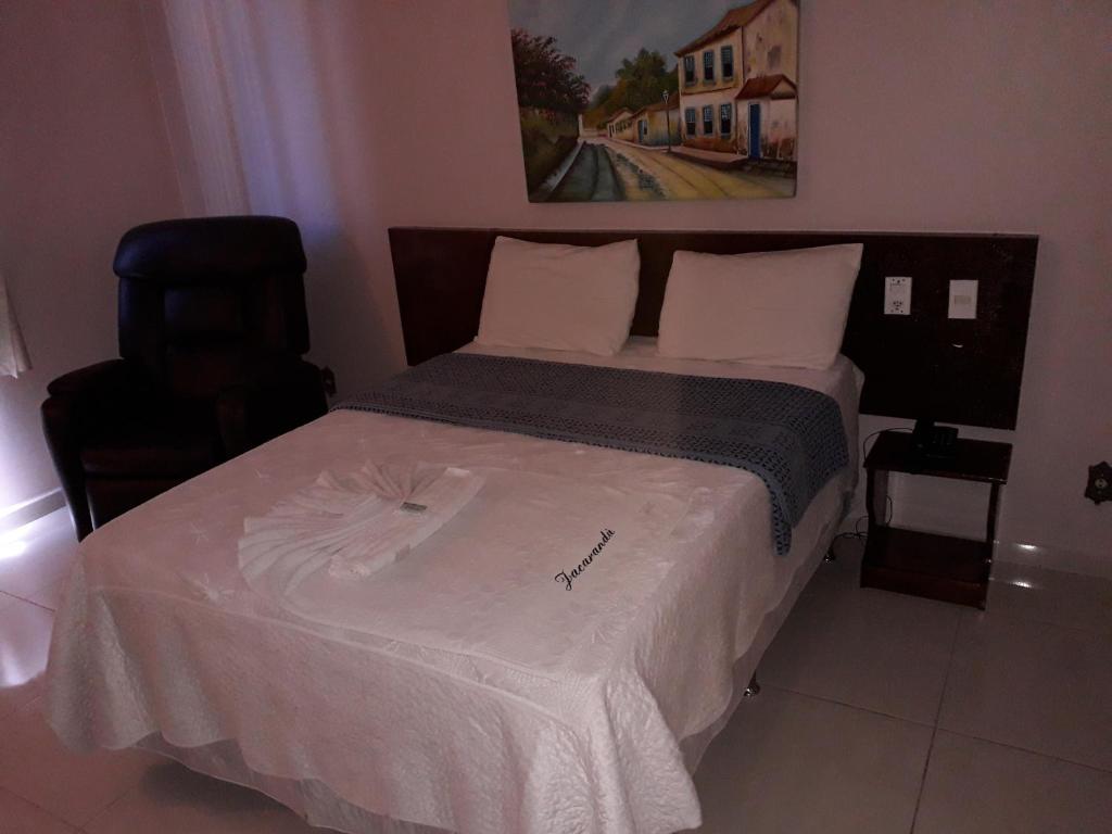 Postel nebo postele na pokoji v ubytování Jacarandá Palace Hotel