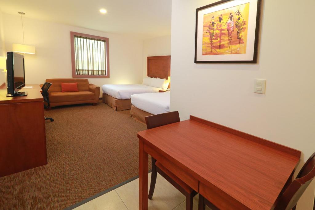 Postel nebo postele na pokoji v ubytování Staybridge Suites Queretaro by IHG