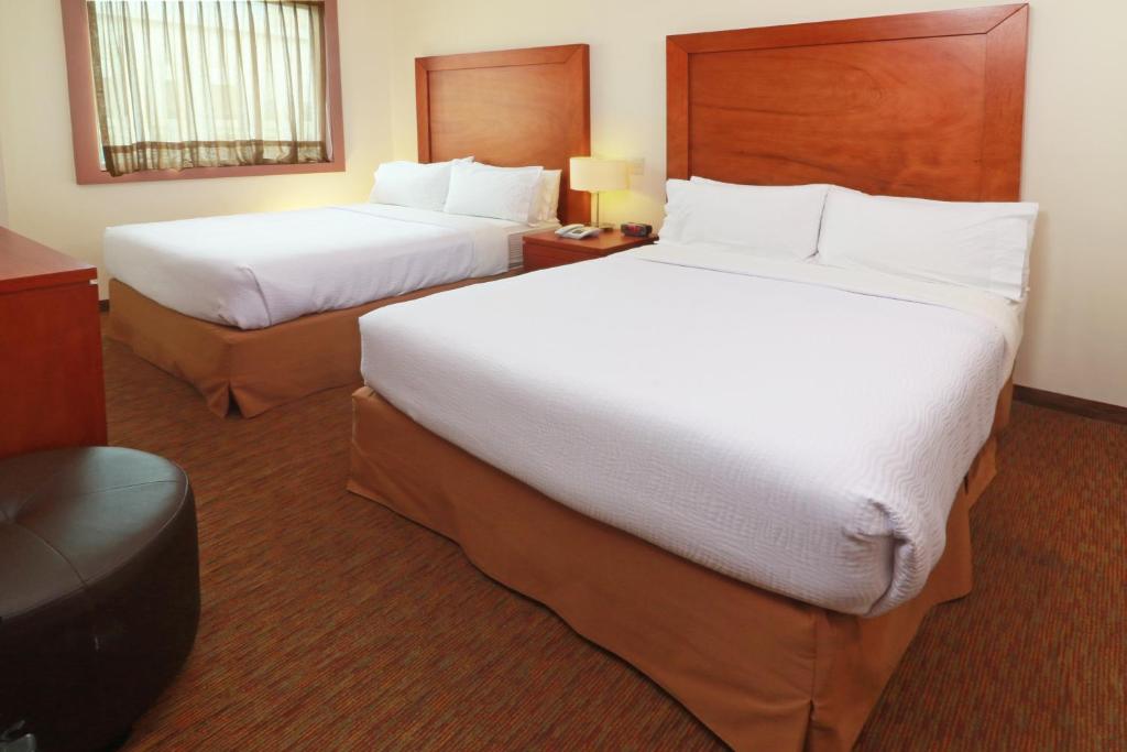 Postel nebo postele na pokoji v ubytování Staybridge Suites Queretaro by IHG