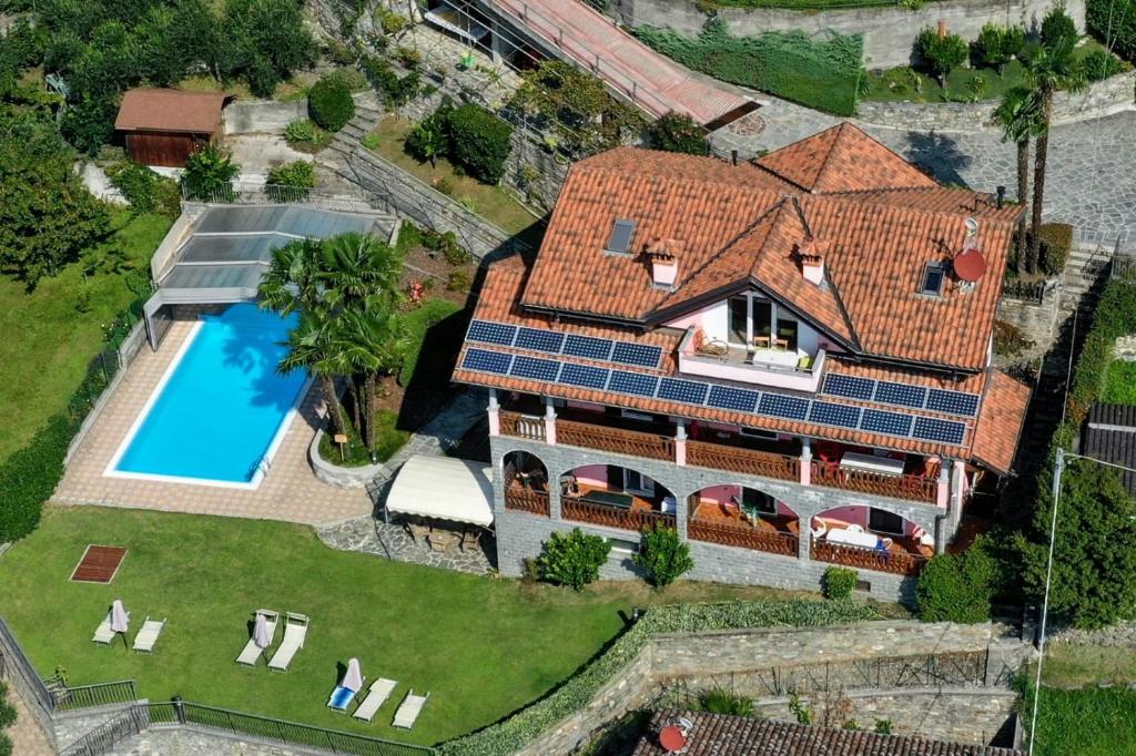 an aerial view of a house with solar panels on it at Residence Casa Rosa in Gera Lario