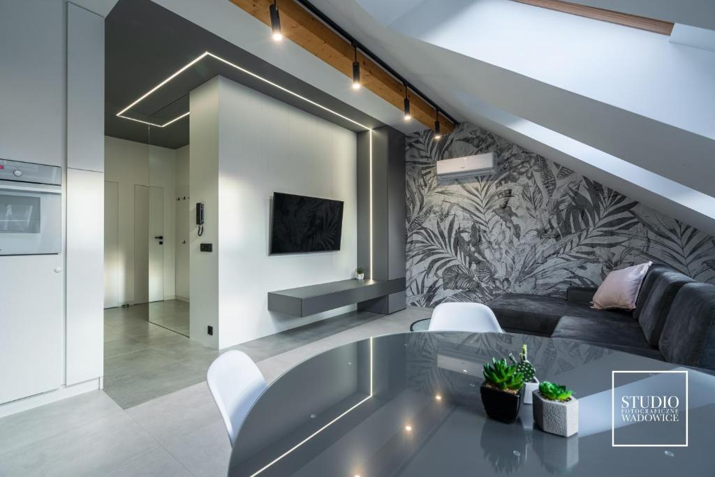 Televízia a/alebo spoločenská miestnosť v ubytovaní Apartamenty Premium New