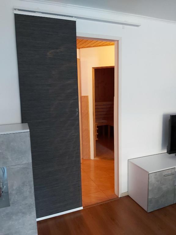 TV a/nebo společenská místnost v ubytování Relax-Apartment mit Sauna