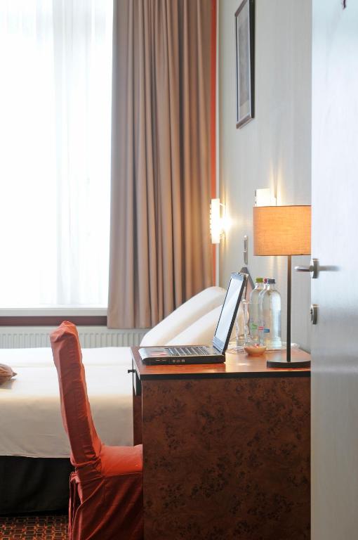 Postel nebo postele na pokoji v ubytování Hotel Grupello