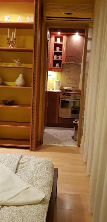 A bed or beds in a room at Obuda Apartment