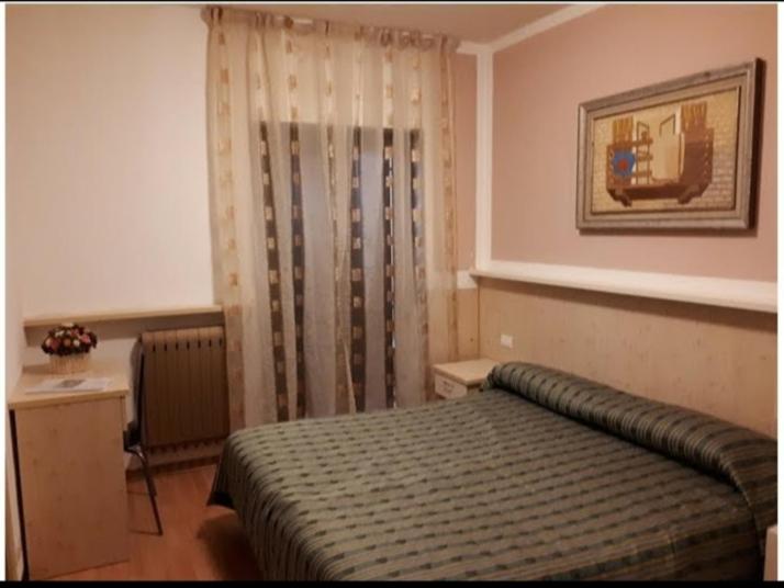Postel nebo postele na pokoji v ubytování Hotel ristorante Bucaneve