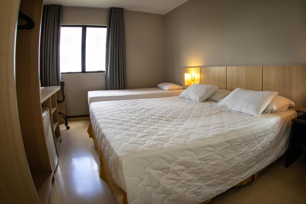 Postel nebo postele na pokoji v ubytování Hotel Campo Largo Express