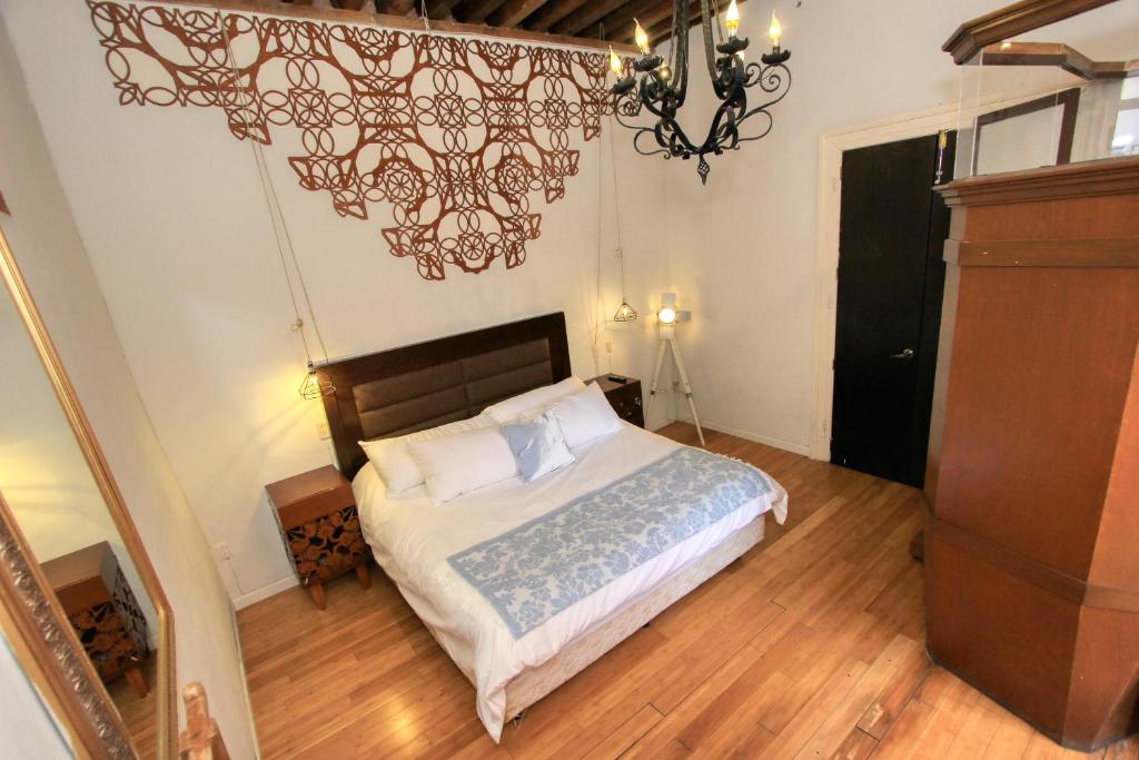 Postel nebo postele na pokoji v ubytování Hotel Mansion Von Humboldt