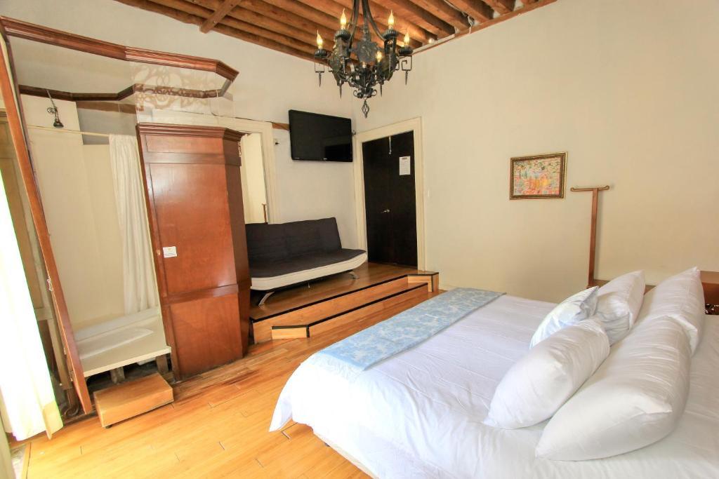 Postel nebo postele na pokoji v ubytování Hotel Mansion Von Humboldt