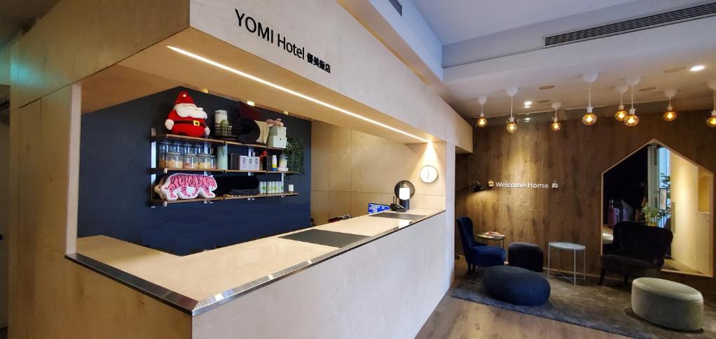 a waiting room with a counter in a salon at Yomi Hotel - ShuangLian MRT in Taipei