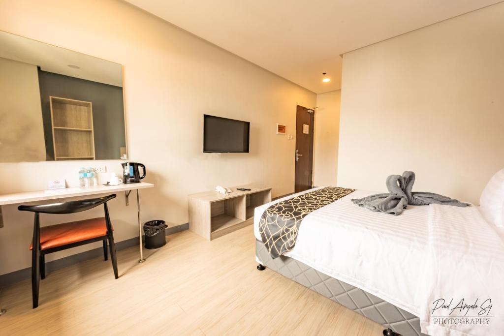 Postel nebo postele na pokoji v ubytování Hotel One