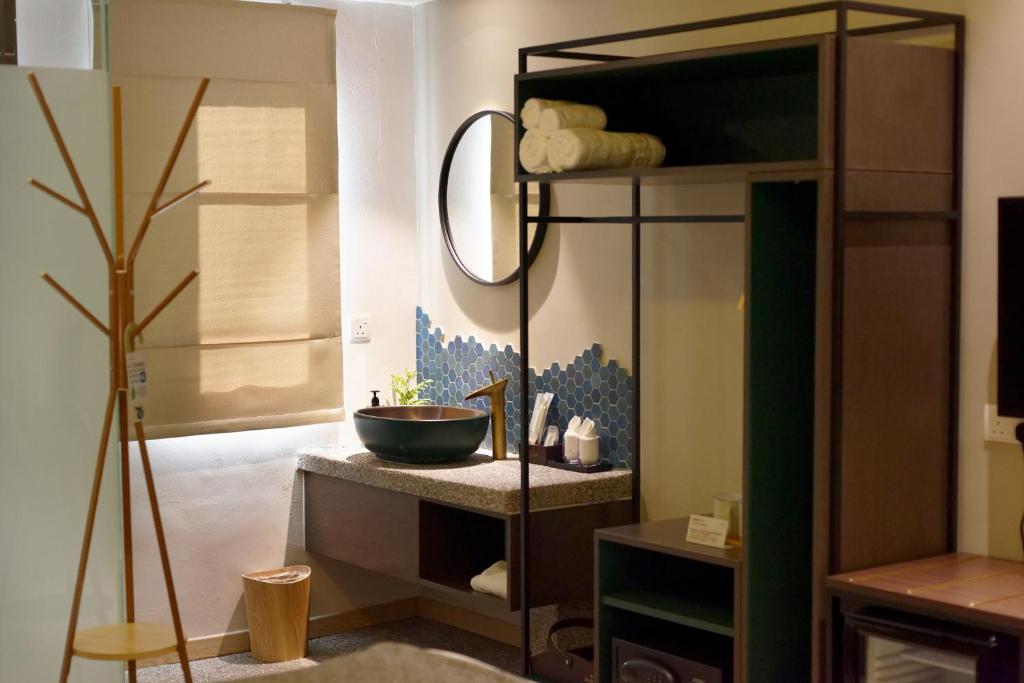 Postel nebo postele na pokoji v ubytování Sojourn Spa Hotel Ipoh