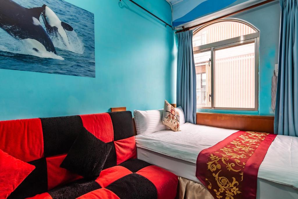 Postel nebo postele na pokoji v ubytování Fei Li Jin Hotel