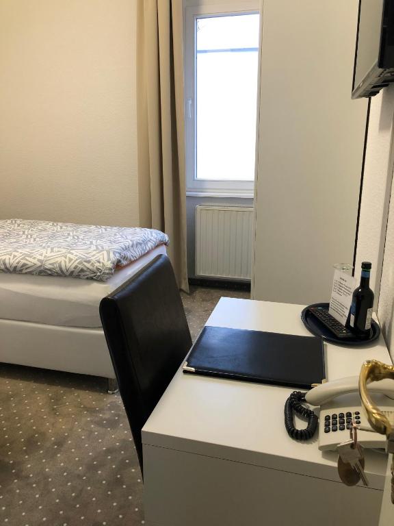 Postel nebo postele na pokoji v ubytování Hotel Goldenes Lamm