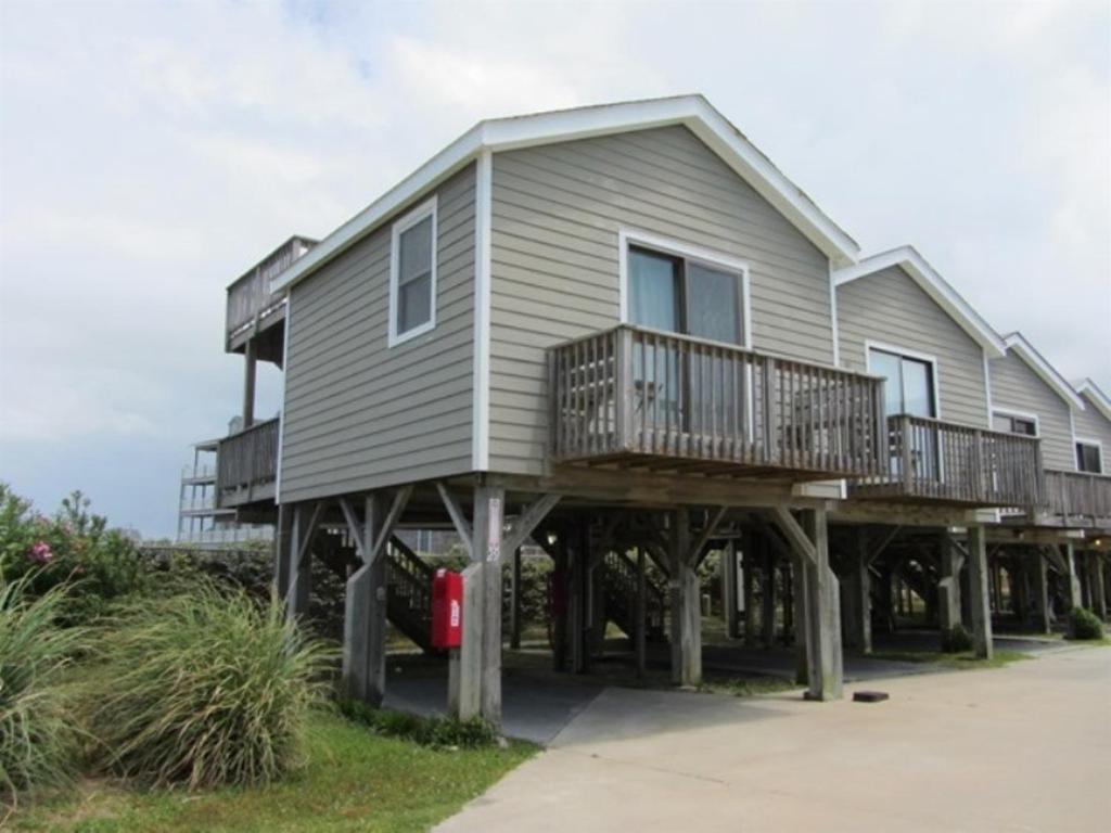 a large house on wooden posts on the beach at NC 12 56821-29 Condo in Hatteras