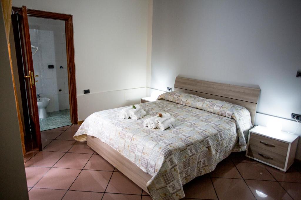Postel nebo postele na pokoji v ubytování B&B L'Aurora CAPUA