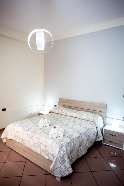 Postel nebo postele na pokoji v ubytování B&B L'Aurora CAPUA