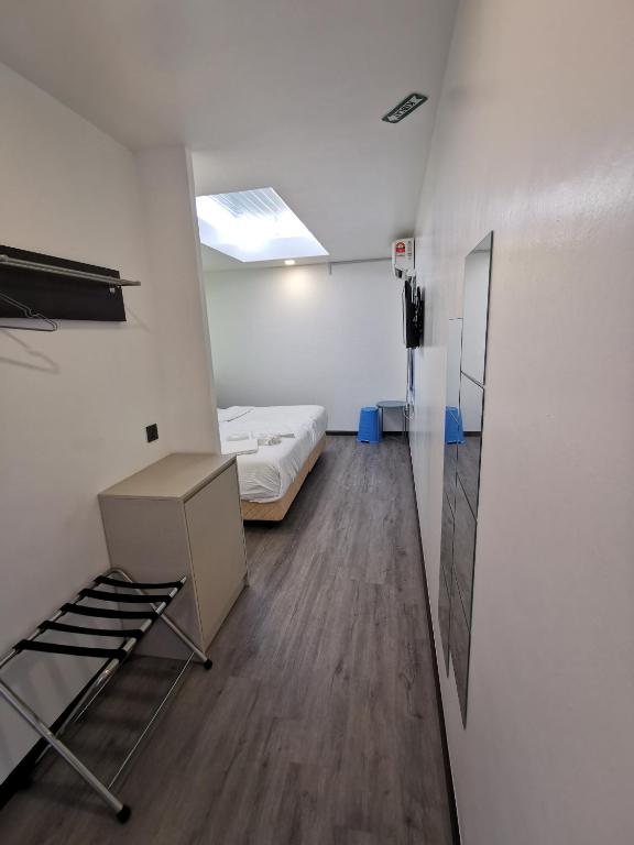 Postel nebo postele na pokoji v ubytování TT Dorf Hotel Matang