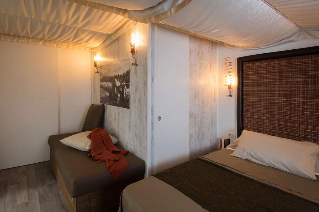 Postel nebo postele na pokoji v ubytování Camping Barco Reale