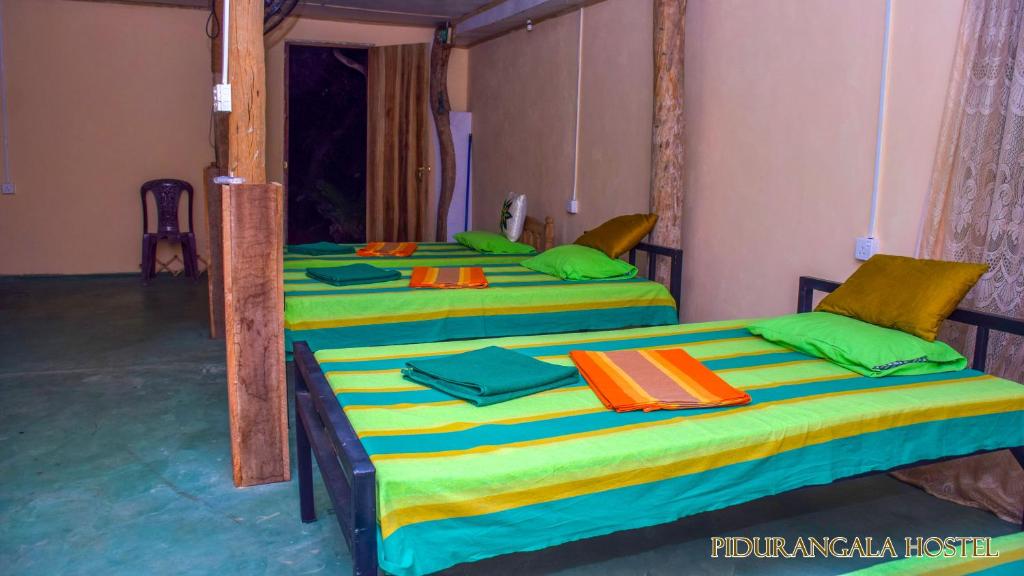 Postel nebo postele na pokoji v ubytování Pidurangala Hostel