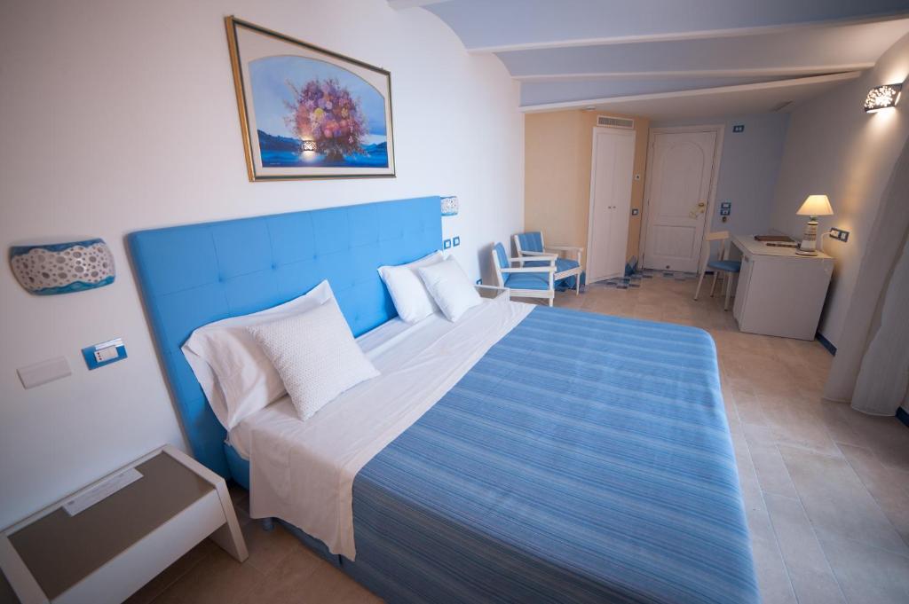 Postel nebo postele na pokoji v ubytování Hotel Rufolo