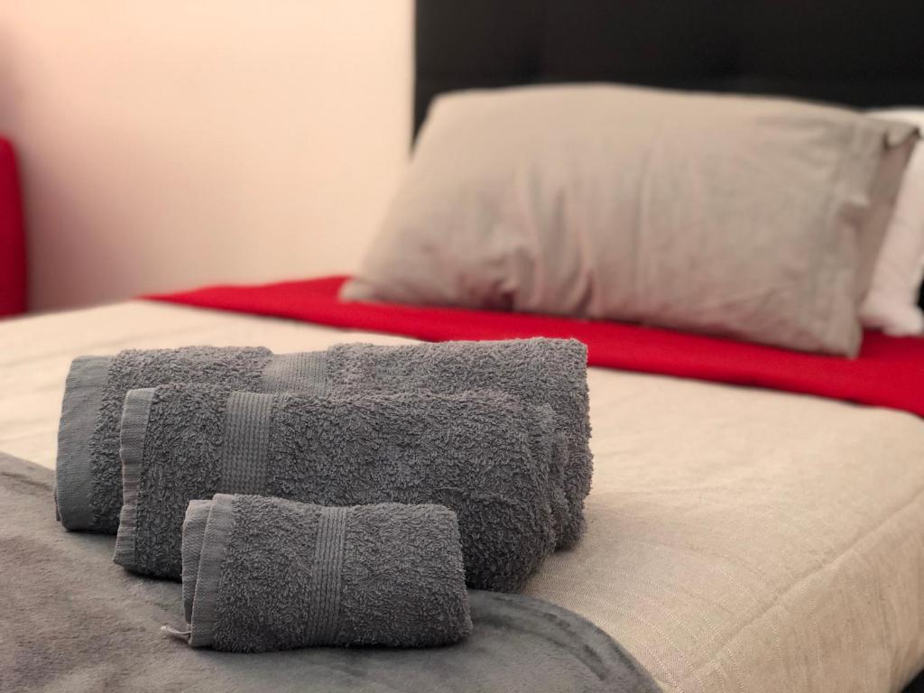 Łóżko lub łóżka w pokoju w obiekcie Viale Umberto I Apartments