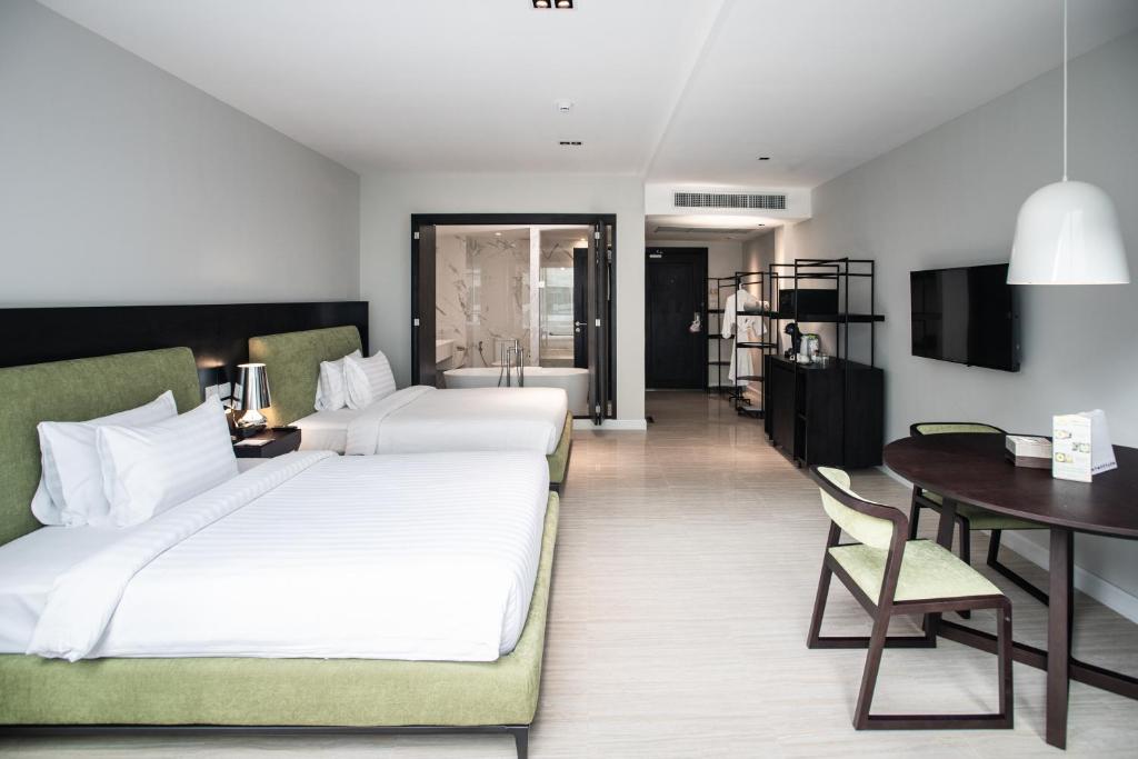 Postel nebo postele na pokoji v ubytování S Ram Leisure Hotel SHA PLUS