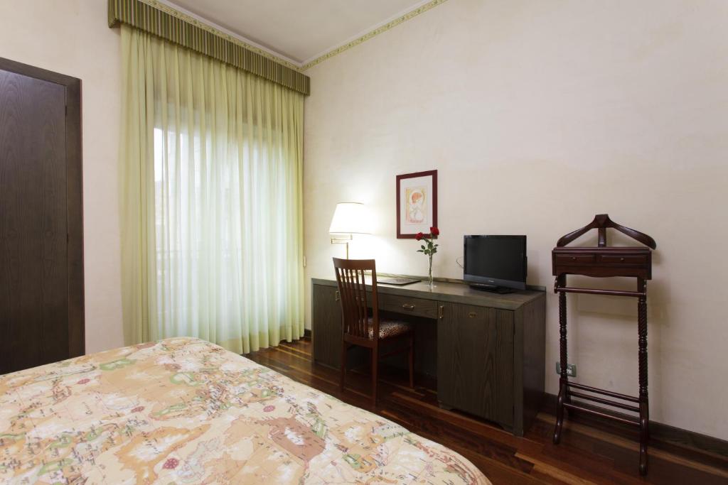 Postel nebo postele na pokoji v ubytování Astor Hotel Vintage