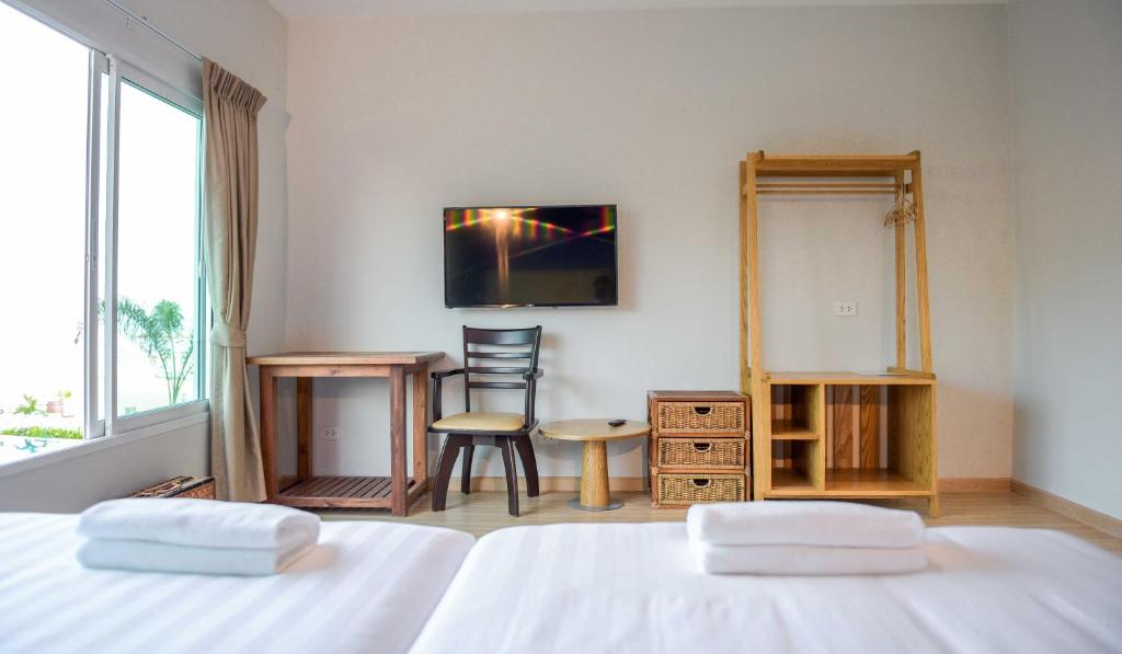 Postel nebo postele na pokoji v ubytování Seaman Resort