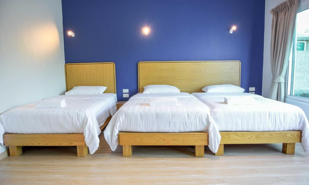 Postel nebo postele na pokoji v ubytování Seaman Resort
