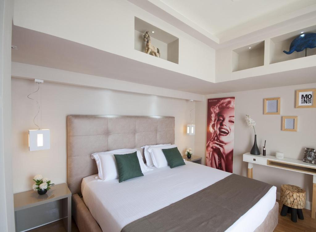 Łóżko lub łóżka w pokoju w obiekcie Terrazza Marco Antonio Luxury Suite