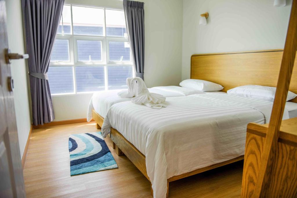 Postel nebo postele na pokoji v ubytování Seaman Resort