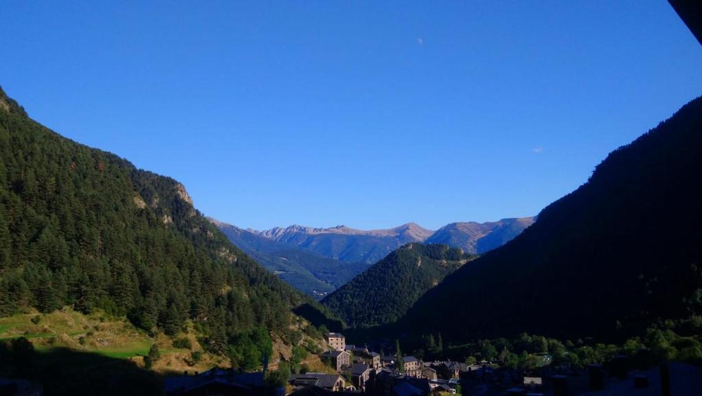 a view of a valley in the mountains with a town at OtaRibasol in Arinsal