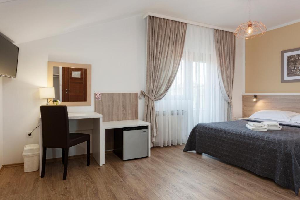 Posteľ alebo postele v izbe v ubytovaní Tourist Center Marko