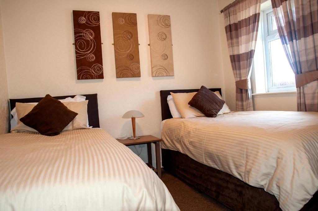 Postel nebo postele na pokoji v ubytování Redbeck Motel