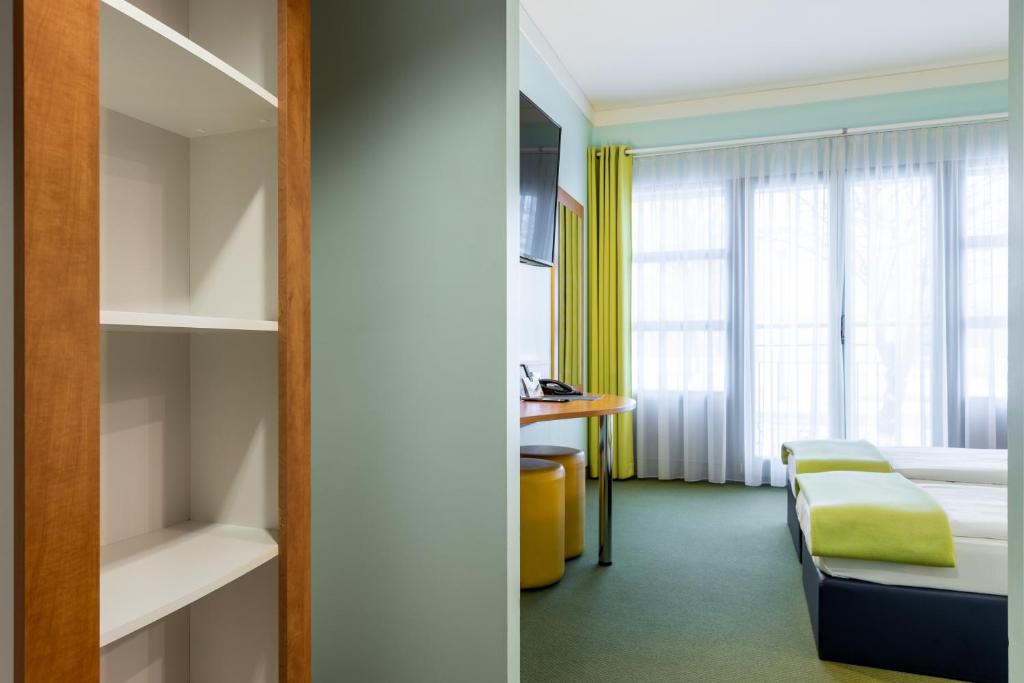 Postel nebo postele na pokoji v ubytování Hotel Fränkische Schweiz-Pegnitz